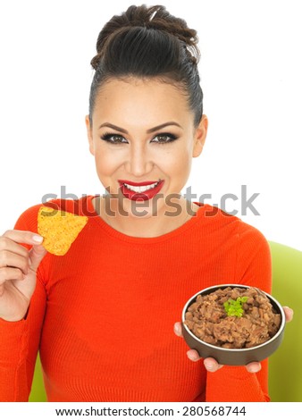 Beautiful Young Hispanic Woman In Her Twenties With Mexican Style Refried Beans Against A White Background