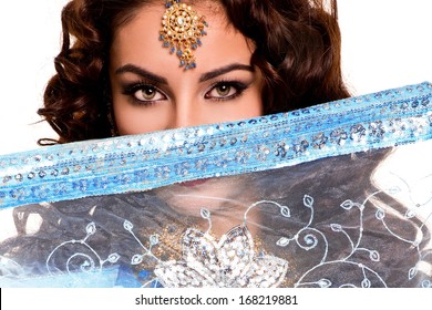 Beautiful young indian woman in traditional clothing with bridal makeup and jewelry. gorgeous brunette bride. Girl bollywood dancer in Sari. Arabian bellydancer 