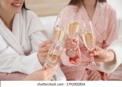 Beautiful Young Ladies Clinking Glasses Of Champagne At Pamper Party, Closeup. Women's Day