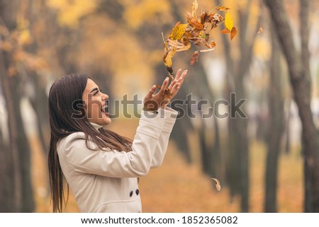 A beautiful young lady having fun in the park