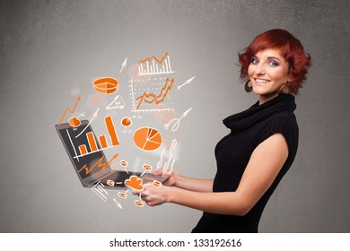 Beautiful young lady holding laptop with graphs and statistics