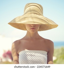 Beautiful Young Lady In Straw Hat In The Sunlight