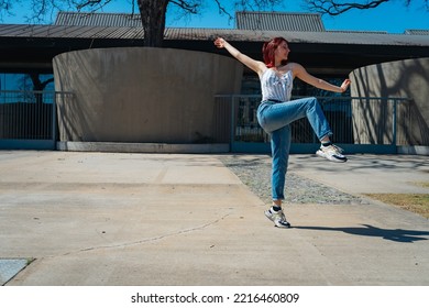 Beautiful Young Latina Dancing Happily In The Street While Partying With Jumps And Somersaults. Concept Of Joy, Street Dance, Hip Hop, Youth.