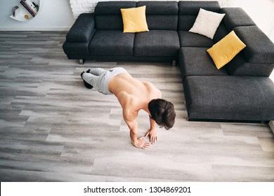 Beautiful Young Man Training And Working Out. Handsome Hispanic Male Athlete Exercising With A Chest Routine For Wellness In His Living Room. Latino People Doing Diamond Pushups And Sport At Home.