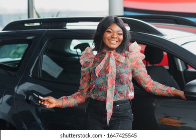 Beautiful Young Mixed Race Black African American Woman Driving Car And Show Holding The Key