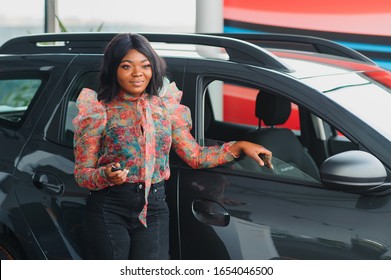 Beautiful Young Mixed Race Black African American Woman Driving Car And Show Holding The Key