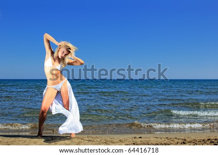 Similar – Young woman walks on the beach