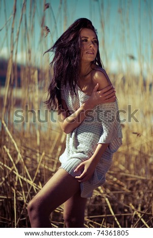 Similar – Image, Stock Photo Young woman at the stand blond hair blows around her