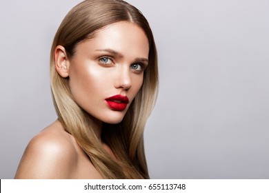 Beautiful Young Model With Red Lips And Nude Manicure