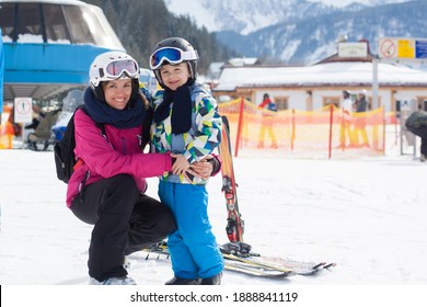 Beautiful Young Mom And Her Toddler Boy, Skiing In The Mountains, Winter Time