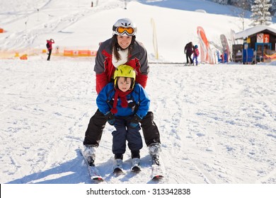 Beautiful Young Mom And Her Toddler Boy, Skiing In The Mountains, Winter Time