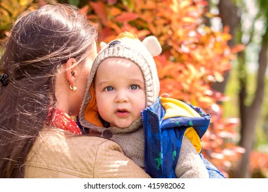 beautiful young mother and child walking in the country