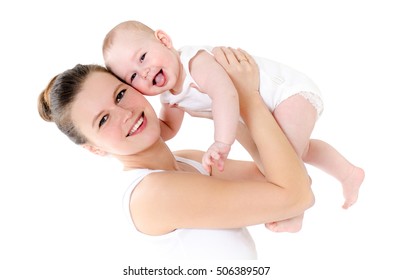 Beautiful Young Mother Tossing Up Her Baby. Baby Laughing. White Background. Studio.