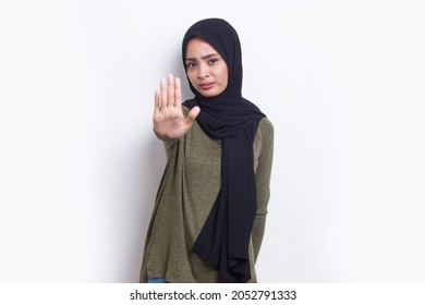 Beautiful Young Muslim Woman With Open Hand Doing Stop Sign With Serious Expression Defense Gesture Isolated On White Background
