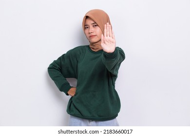 Beautiful Young Muslim Woman With Open Hand Doing Stop Sign With Serious Expression Defense Gesture Isolated On White Background
