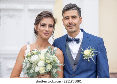 Beautiful Young Newlyweds Smiling To The Camera Shortly After Getting Married.