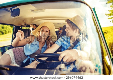 Similar – Two young women resting sitting inside of car