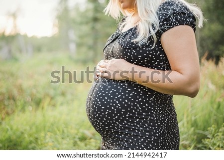 Similar – Foto Bild Schwangere Frau, die ihren Bauch streichelt.