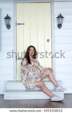 Similar – Woman in front of a yellow beach house