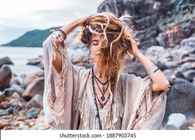 Beautiful Young Pretty Woman Playing With Hair Outdoors At The Stone Beach 