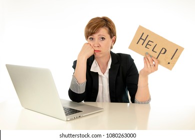 beautiful young red haired caucasian tired and frustrated business woman working on her computer holding a help sign at work office desk on a white background.Stress and business frustration concept - Shutterstock ID 1080263000