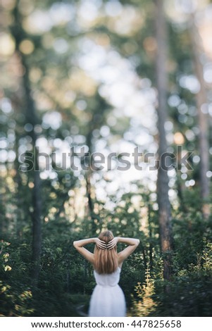 Similar – Image, Stock Photo Low angle view of blonde white girl posing in the forest with trees in the background.