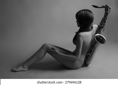 Beautiful Young Sexy Woman With Sax.musical Girl.fashion Monochrome Portrait