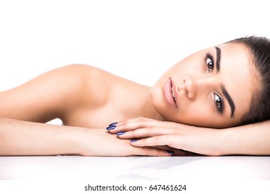 Beautiful Young Smiling Latina Lying On The White Background.