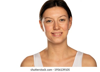 Beautiful young smiling woman without makeup on a white background