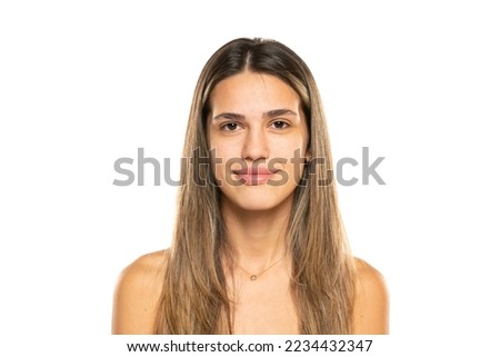 beautiful young smiling women with long balayage painted hair and no makeup on a white background.