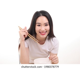 Beautiful Young South East Asian Woman Holding Chinese Empty Chopstick Soup Spoon Bowl Utensil Pretend Acting Posing See Eat Taste Feed Offer Satisfaction Yummy White Background Happy