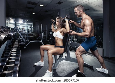 Beautiful Young Sporty Sexy Couple Workout In Gym