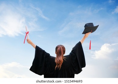 Beautiful Young Student In Black Robe, Standing Up With Arms In 