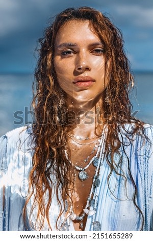 beautiful young stylish woman on in water portrait