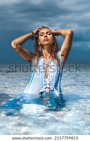 beautiful young stylish woman in water 