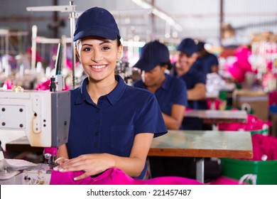 Beautiful Young Textile Machinist Using Sewing Machine In Clothing Factory