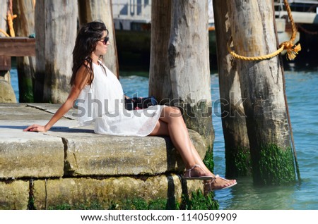 Beautiful Young Traveler Woman Taking Photos in Venice ,Italy  
