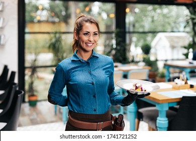 Beautiful Young Waitress Working In Exclusive Restaurant.