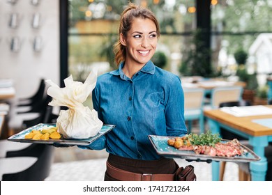 Beautiful Young Waitress Working In Exclusive Restaurant.