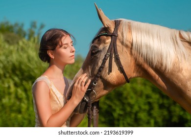 A Beautiful Young Woman In A 19th Century Dress And A Horse. Close-up, Portrait Photography