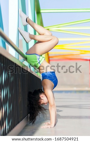 Similar – Unrecognizable women jumping over garden fence background