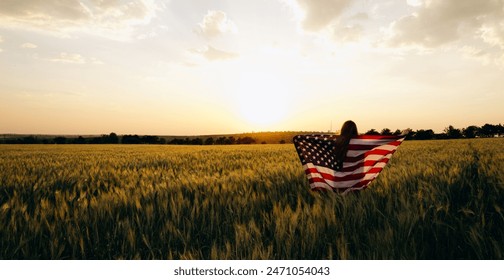 Beautiful young woman with American flag in a wheat field at sunset. 4th of July. Patriotic holiday, american day. Independence Day.	 - Powered by Shutterstock