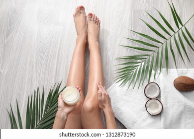 Beautiful Young Woman Applying Coconut Oil At Home