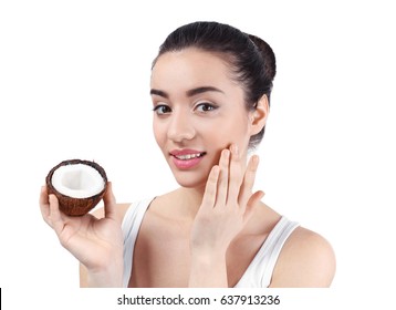 Beautiful Young Woman Applying Coconut Oil Onto Skin On White Background