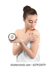 Beautiful Young Woman Applying Coconut Oil Onto Skin On White Background