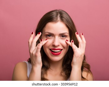 Beautiful Young Woman Applying An Eye Cream