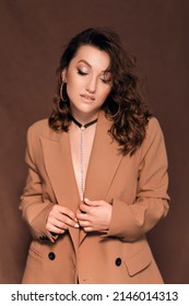 Beautiful Young Woman In A Beige Jacket With A Choker Around Her Neck