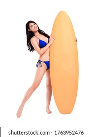 Beautiful young woman in bikini and  standing with  surfboard 
