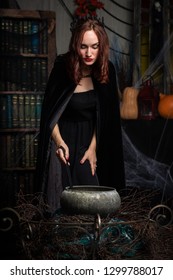Beautiful young woman in black dress indoor - Shutterstock ID 1299788017