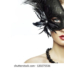 Beautiful Young Woman In Black Mysterious Venetian Mask. Fashion Photo